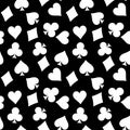 Seamless pattern background of white poker suits - hearts, clubs, spades and diamonds - on black background. Casino