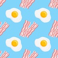 Seamless pattern with bacon strips and fried eggs. Vector texture.