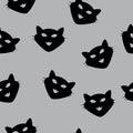 Seamless Pattern of black cat heads on grey background. Vector illustration. Animal silhouette. Wallpaper and fabric design and. Royalty Free Stock Photo