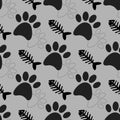 Seamless pattern with black dog paws and fish bones skeletons on gray background. Vector flat cartoon illustration. Royalty Free Stock Photo