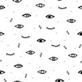 Seamless pattern with black eyes on a white background. Black spots.