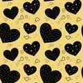 Seamless pattern with black and gold hearts on yellow background. Valentine`s Day Royalty Free Stock Photo