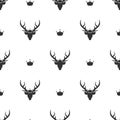 Seamless pattern with black silhouette of deer head with royal crown Royalty Free Stock Photo