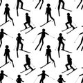 Seamless pattern with black silhouettes of skiing people: man; woman; child. Winter sport games.