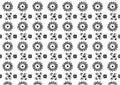 A seamless pattern of black and white flowers and swirls on a white background. The flowers are arranged in a circle