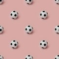 Photographic collage, seamless pattern of black and white football balls isolated on pink background. Minimalistic shot