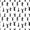 Seamless pattern with black and white silhouettes of crowd of young happy multinational diverse people in jumping poses