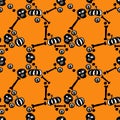 Seamless pattern with black and white skulls, bones and pumpkins. Royalty Free Stock Photo