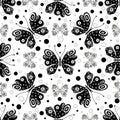 Seamless pattern with black and white symmetrical butterflies Royalty Free Stock Photo