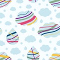 Seamless pattern with blue clouds and drops with colorful rainbow lines. Nursery art design for decoration, childish printing for Royalty Free Stock Photo