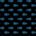 Seamless pattern with blue neon mail envelope icons on black background. Email, message, letter concept. Vector Royalty Free Stock Photo