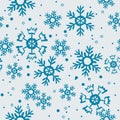 Seamless pattern of blue snowflakes on light background. Print of Christmas thematic. Royalty Free Stock Photo