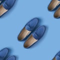 Seamless pattern of blue suede man`s mocassin shoes over blue background