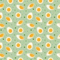 Seamless pattern with boiled egg slices and halves