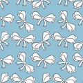 Seamless pattern with bows isolated on blue. Color bright bowknots endless texture.