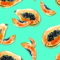 Seamless pattern with bright exotic papaya fruit on blue background. Ripe papaya with black seeds cut in half. Royalty Free Stock Photo