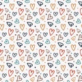 Seamless pattern with bright hand drawn hearts scattered on a light background