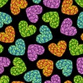 Seamless pattern with bright multi-colored polygonal hearts on a black background. Royalty Free Stock Photo