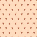 Seamless Pattern of Brown Hearts on a Beige Background Royalty Free Stock Photo