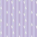 Seamless pattern with bunches of white flowers and vertical stripes on purple background