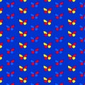 A seamless pattern with butterflies on a dark blue background