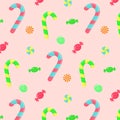 Seamless pattern with candy canes, swirl caramels and wrapped candies Royalty Free Stock Photo
