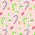 Seamless pattern with candy canes, swirl caramels and wrapped candies Royalty Free Stock Photo