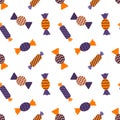 Seamless pattern with candy wrappers. Orange-purple colors. A backdrop for Halloween cards. Color vector illustration in a flat Royalty Free Stock Photo
