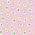 Seamless pattern of a card game on a soft pink background.