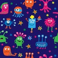 Seamless pattern with cartoon aliens on a blue background