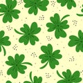 Seamless pattern with cartoon clover, decor elements on a neutral background. festive colorful vector for St. Patrick`s Day. Hand Royalty Free Stock Photo