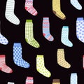 seamless pattern with cartoon socks on a black
