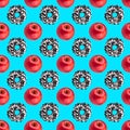 Seamless pattern chocolate donuts and red apples isolated on blue background, healthy vs junk food concept, cakes or fruits diet Royalty Free Stock Photo