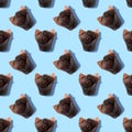 Seamless pattern of chocolate muffin with light blue background. Sweetness pastel colors. Confectionery banner. Colorful