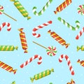 Seamless pattern with Christmas candies and on blue background. Xmas, New Year, lollipop, sweets concept for wrapping, wallpaper,