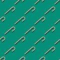 Seamless pattern of Christmas candy cane on green background Royalty Free Stock Photo