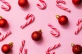 Seamless pattern from christmas candy canes and red balls, festive design paper