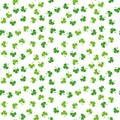 Seamless pattern of clover leaves. Random floral vector background. Green plant. Traditional Iraland holiday symbol