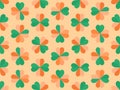 Seamless pattern with clover for Saint Patrick`s Day. Clover with green and orange petals. Background for advertising products,