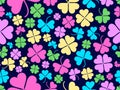 Seamless pattern with clover for Saint Patrick`s Day. Multi-colored four-leaf clovers on a dark background Royalty Free Stock Photo