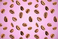 Seamless pattern of coffee beans on a pink background Royalty Free Stock Photo