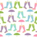 Seamless pattern with colored rubber boots and umbrellas. Vector
