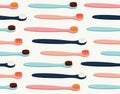 Seamless pattern of colored toothbrushes in pink, yellow, blue, and burgundy color. Royalty Free Stock Photo
