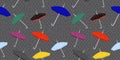 Seamless pattern with colored umbrellas on a gray background.