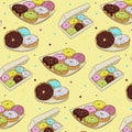 Seamless pattern of colorful donuts in icing, isolated on a white background. Vector illustration in cartoon flat style Royalty Free Stock Photo