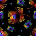 Seamless pattern of colorful peacock feathers on a black background. Royalty Free Stock Photo