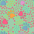Seamless pattern with colorful pets paws and bright dots on light green background. Cat or dog footprint outline cute childish Royalty Free Stock Photo