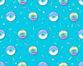 Seamless pattern of colorful rainbow sweet donuts. Junk food background