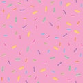 Seamless pattern colorful sweet sprinkles on pink background Royalty Free Stock Photo