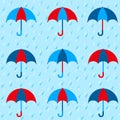 Seamless pattern with colorful umbrellas on blue rainy background